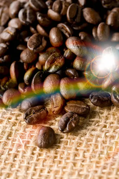 roasted coffee beans on a light background