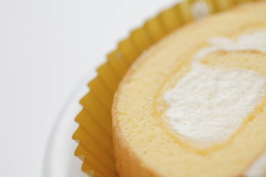 Arkaplanda lezzetli, tatlı vanilyalı rulo