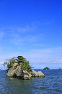 beautiful scenery of sea and rocky islands with lush green vegetation. Matsushima islands in Miyagi Prefecture, Japan clipart