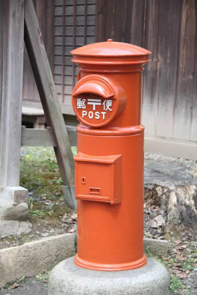close up view of red mail box on street