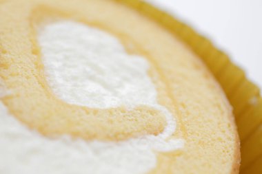 Arkaplanda lezzetli, tatlı vanilyalı rulo