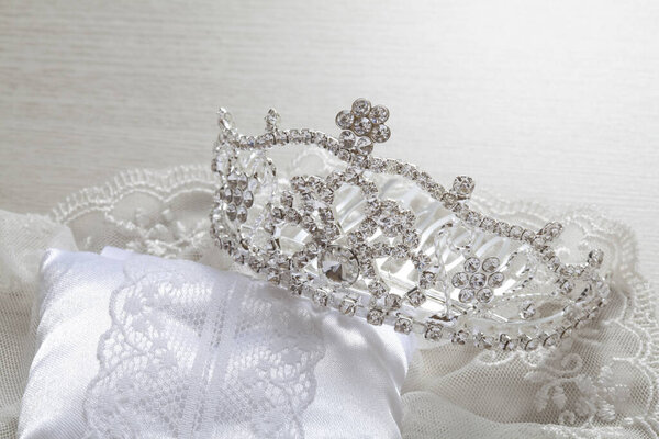beautiful luxury crown on elegant fabric. beauty and fashion.       