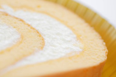 Arkaplanda lezzetli, tatlı vanilyalı rulo