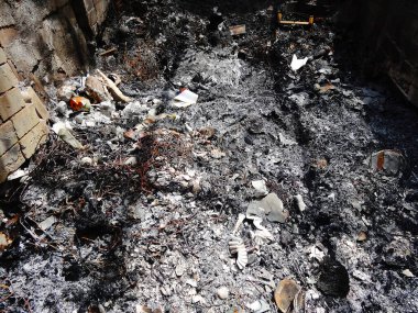 Charred debris scattered on ground
