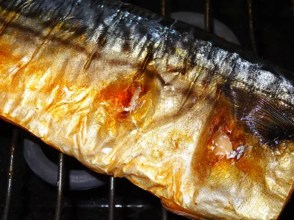 close-up view of gourmet fish cooking on the grill