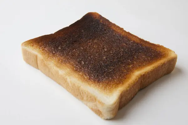 Slice Burnt Toast White Background — Stock Photo, Image