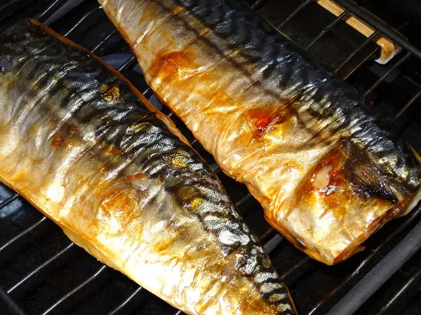 close-up view of gourmet fish cooking on the grill