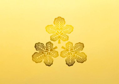 Sarı arka planda altın çiçekli logo