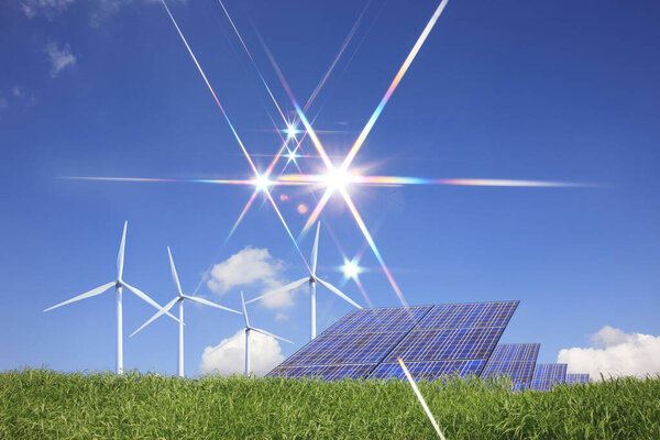 солнечные батареи и ветряные турбины на зеленом лугу. альтернативный источник энергии              