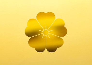 Sarı arka planda altın çiçekli logo