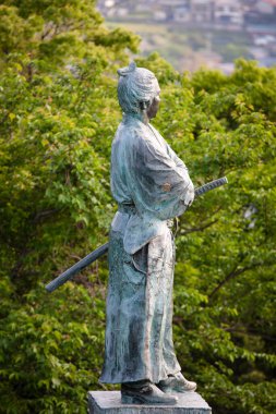 Sakamoto Ryoma bronze monument in Nagasaki, Japan clipart