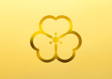 Sarı arka planda altın bitki logosu. Çiçek temalı rozet