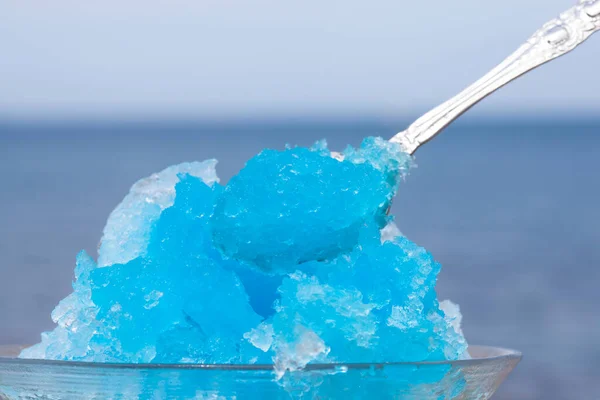 Cold shaved ice on background, close up