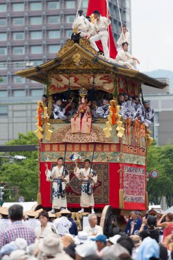 Gion Matsuri Festival, Yamaboko Junko Procession. People pulling the large wooden traditional float parade on the city street clipart