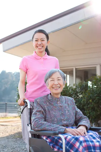 Woman Caregiver Helping Elderly Asian Woman Wheelchair — Stock Photo, Image