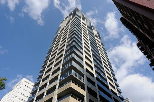 stock image modern skyscraper under a clear blue sky