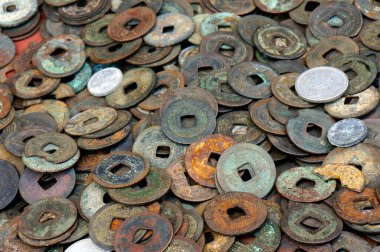 Collection of old coins with various colors and textures
