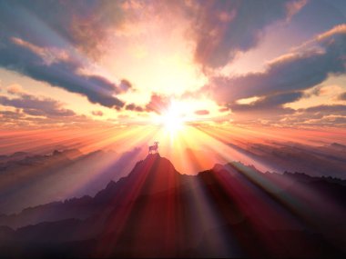 Dağların tepesinde dağ keçileriyle gün batımının güzel bir görüntüsü.