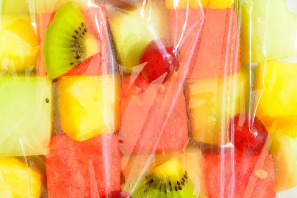Close Fresh Fruit Salad Watermelon Pineapple Grapes Kiwis Covered Transparent — Stock Photo, Image