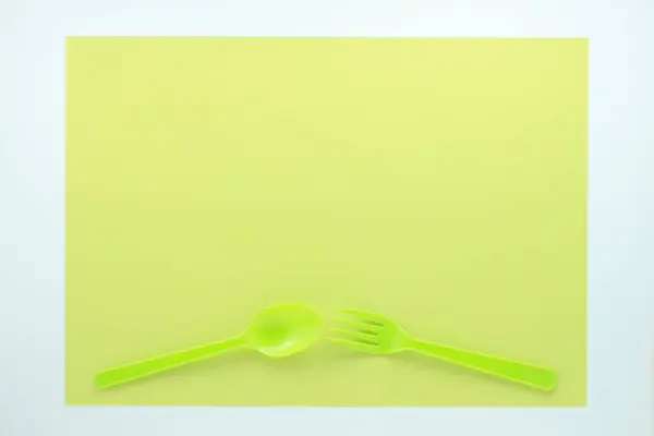 Top View Bright Plastic Cutlery Light Green Background — Stock Photo, Image