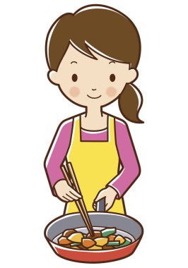 Gülümseyen kadın yemek çubuklarıyla sebze pişiriyor.