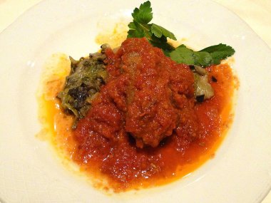 grilled meat with sauce on white plate