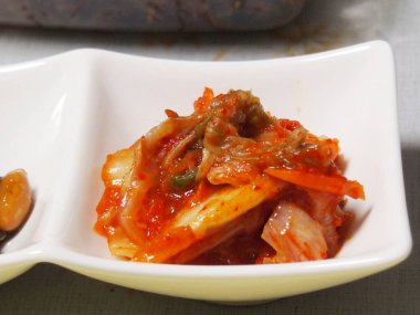 grilled meat with sauce on white plate