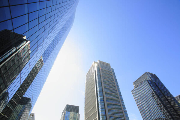 Landscape skyscrapers standing under the blue sky