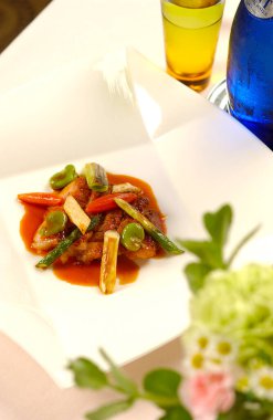 Serving delicious gourmet dish beautifully arranged