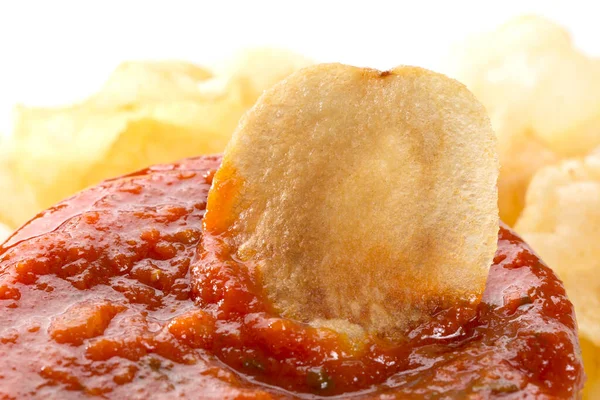 fried chips with chili sauce  on background, close up