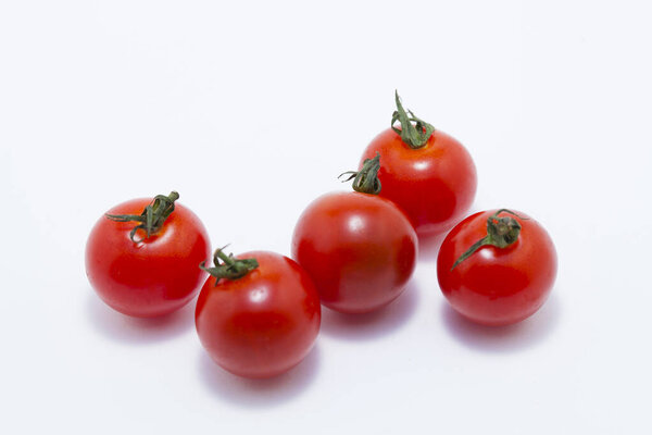 red fresh tomatoes on white background     