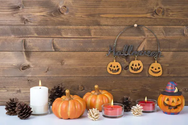 Composição Halloween Com Abóboras Velas Chamas Superfície Madeira — Fotografia de Stock
