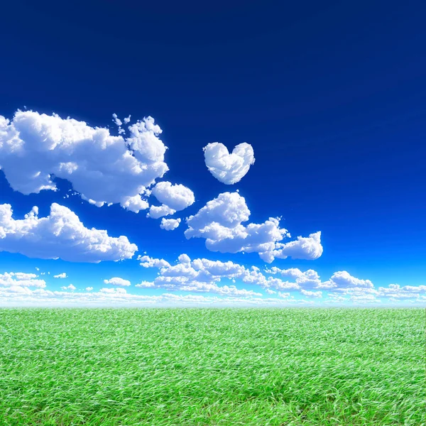 Green grass with blue sky with clouds in heart shape as background