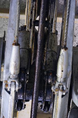 Mechanical components showing gears and chains in machinery