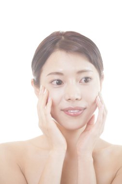 Temiz ciltli güzel Asyalı bir kadın..