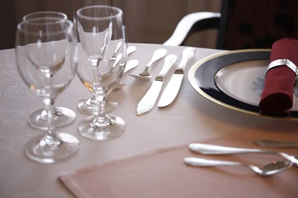 elegant table setting with glasses and cutlery