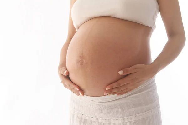 Беременная Женщина Прикасается Животу Белом Фоне — стоковое фото
