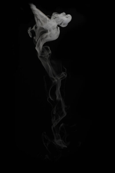 White smoke in black background