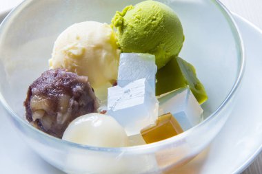 Enjoying colorful dessert with ice cream