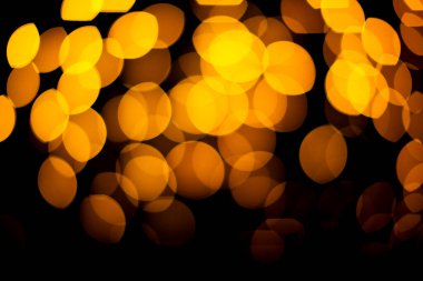 Altın ve siyah Bokeh soyut arkaplan. Noellerde arka plan çözüldü. Odaklanmamış arkaplan