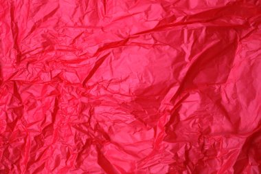 Buruşmuş kırmızı kağıdın soyut dokusu        