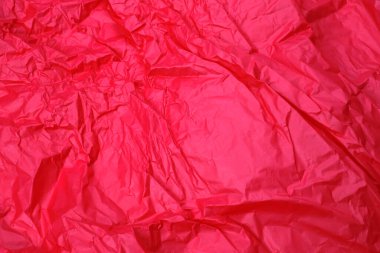 Buruşmuş kırmızı kağıdın soyut dokusu        