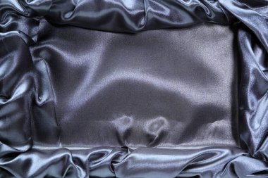 Gümüş saten hediye kutusu arkaplanının yakın plan görüntüsü. 