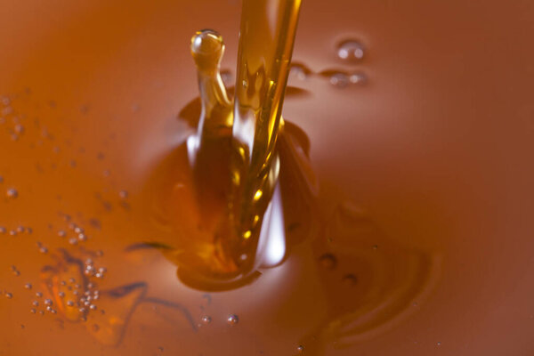 Close up view of pouring honey. Macro photography