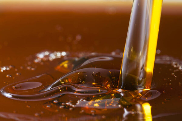 Close up view of pouring honey. Macro photography
