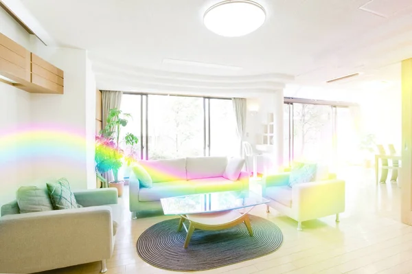 rainbow living room with a modern design. a large panoramic window with a white sofa. rainbow room with a large rainbow in a modern house.