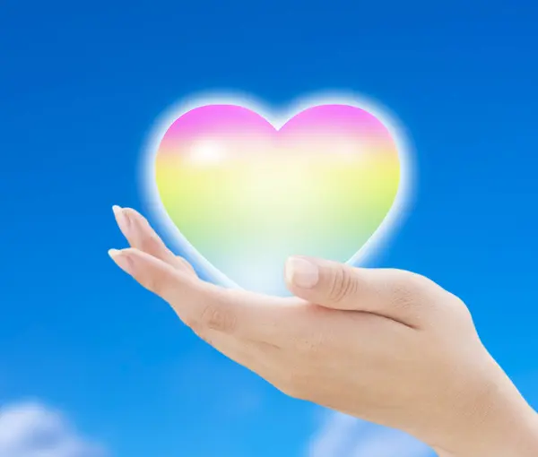 Mano Sosteniendo Corazón Arco Iris —  Fotos de Stock