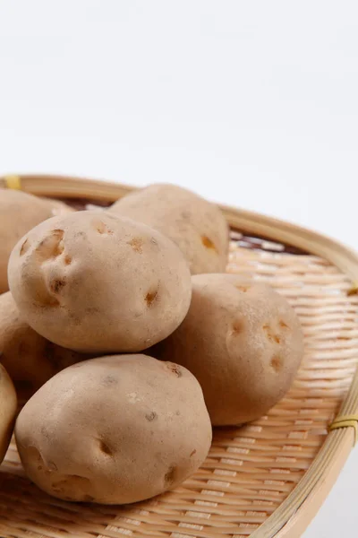 Potatoes Bamboo Sieve — Stock Photo, Image