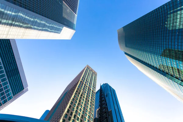 Low Angle View Modern Glass Skyscrapers Reaching Blue Sky Stock Photo