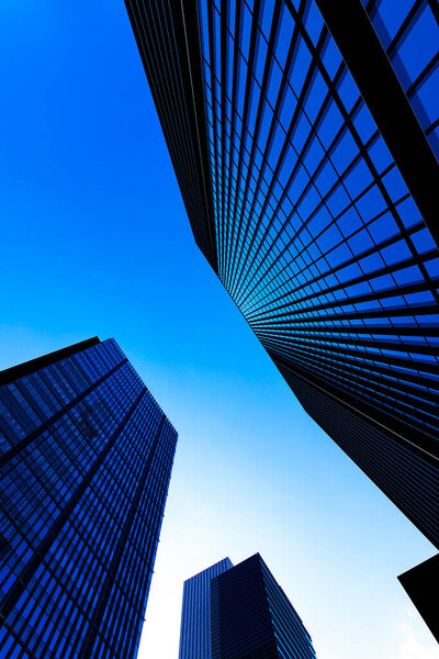Modern skyscrapers against blue sky, illustration